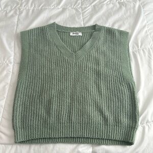 Sleeveless green sweater